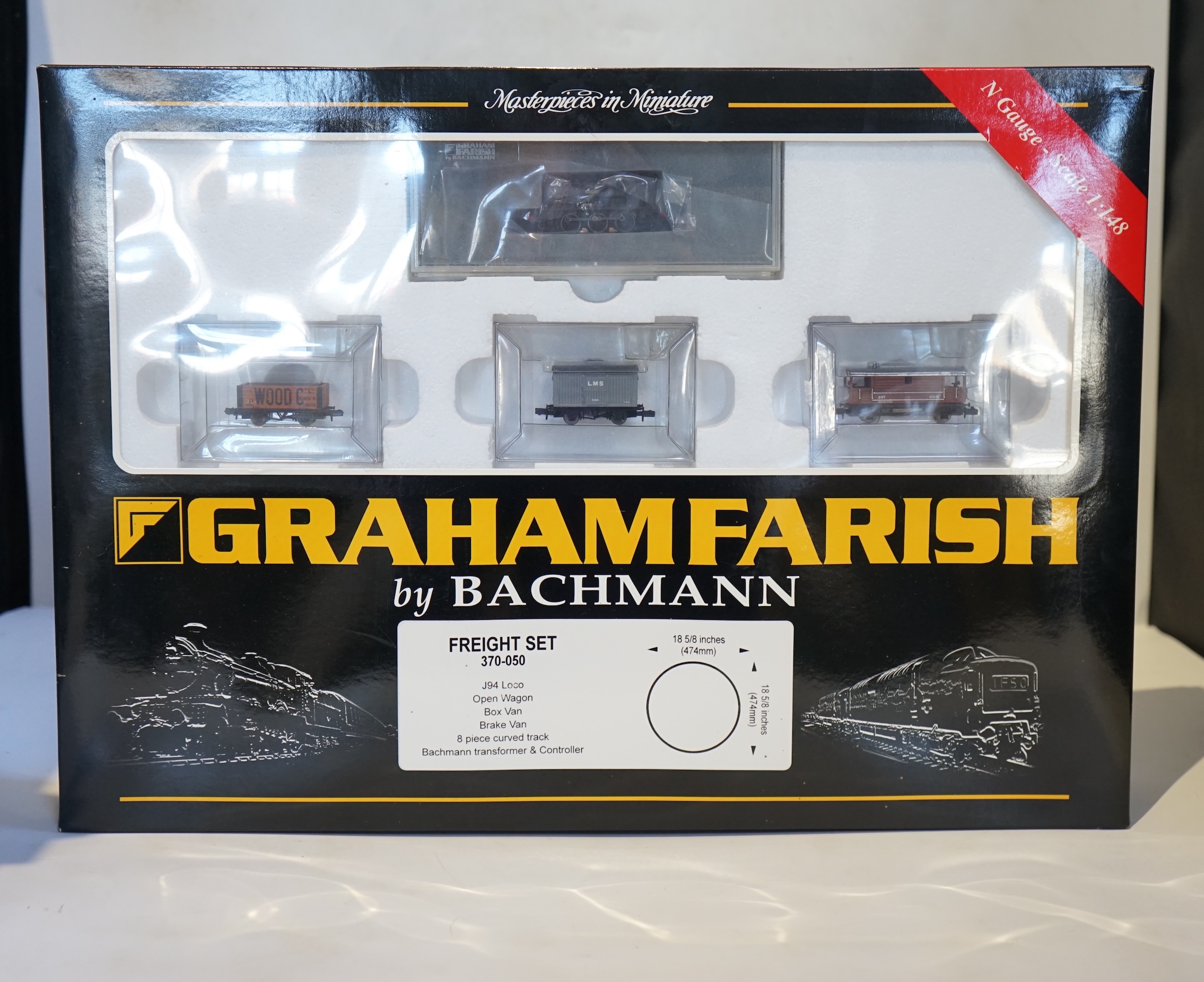 Four boxed Graham Farish N gauge railway train sets; a Diesel Freight set, comprising a Class 25 diesel locomotive and five freight wagons, together with a J94 Freight set with three wagons (370-050), a Queen Elizabeth G